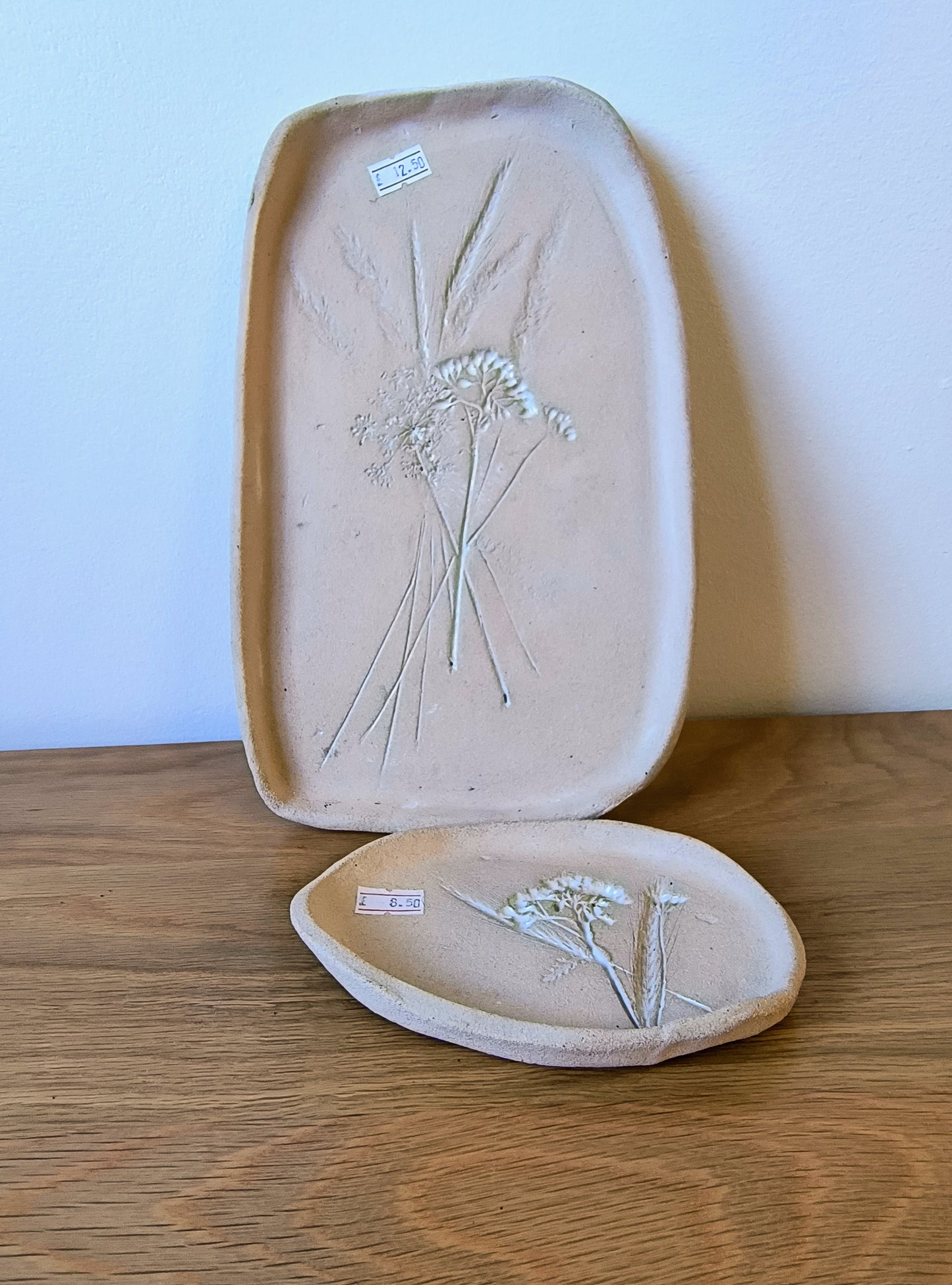 Raw clay platter and small dish with flower motif