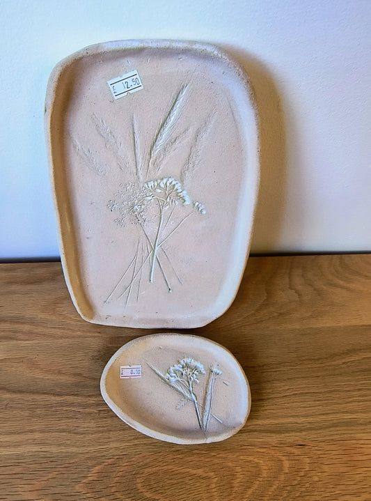 Raw clay platter and small dish with flower motif